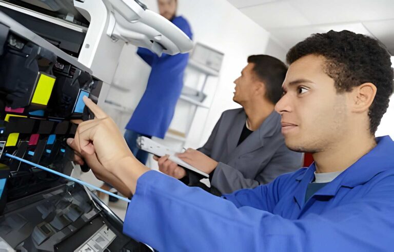 a-printer-repair-technician-sharjah a printer technician repairing a printer in Sharjah